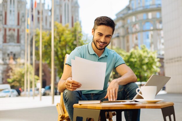 Ambitious young man working on a terrace