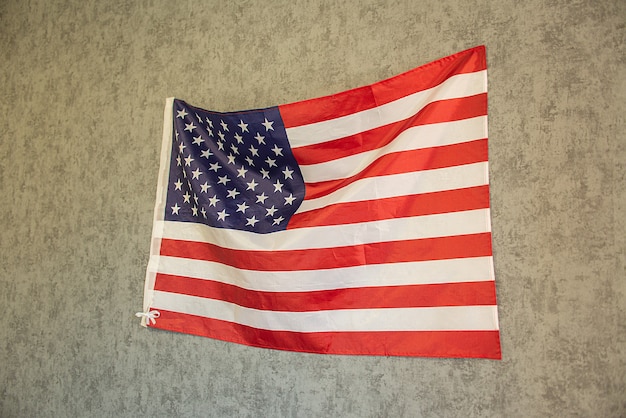 america flag on a concrete wall. 4th july independence day usa. american flag for memorial day