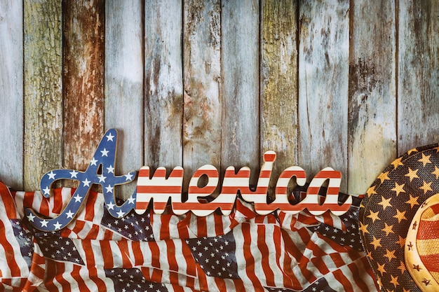 America sign decorated letter USA national holidays Memorial day American flag on wooden background