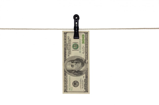 American 100 dollar bank note in a clothesline - Money laundering - dirty money  concept - isolated