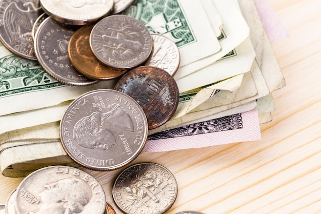 American bills and coins on the table.