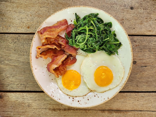 American breakfast top view on wooden table background