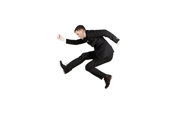 American businessman jumping in the studio