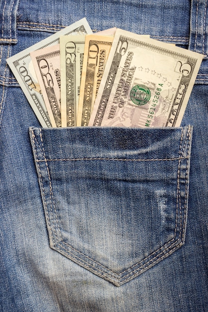 American dollar bills in jeans pocket