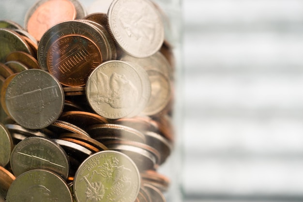 American Dollar Currency Coins in Jar Pennies Nickels Quarters Dimes