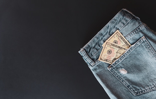 American dollars in jeans pocket. 