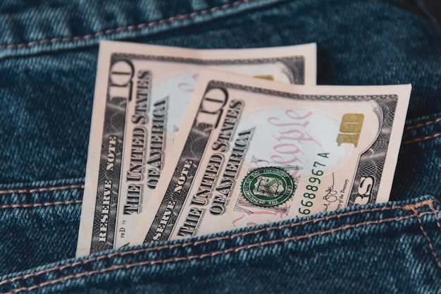 American dollars in jeans pocket. 