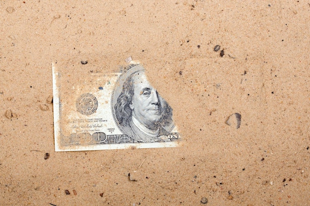 American dollars in the sand