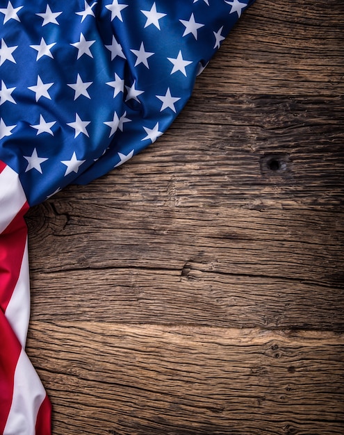 American flag American flag freely lying on wooden board Closeup Studio shot Toned Photo