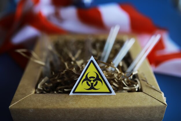 American flag and biohazard sign The concept of American biolabs and research centers