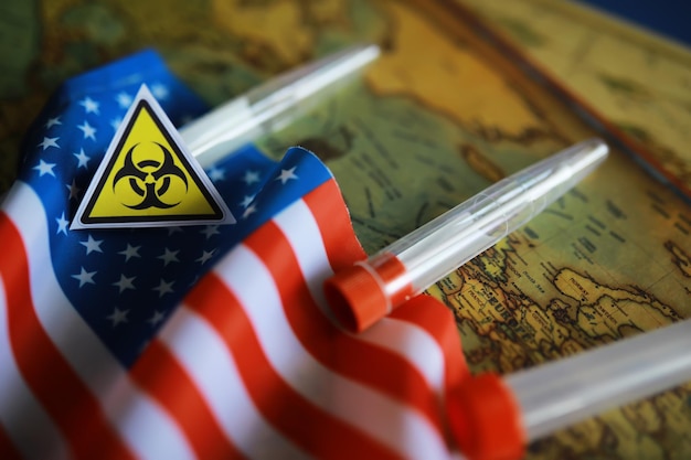 Photo american flag and biohazard sign the concept of american biolabs and research centers