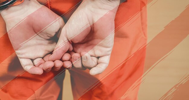 American flag design stripes against close up of with criminal wearing handcuffs