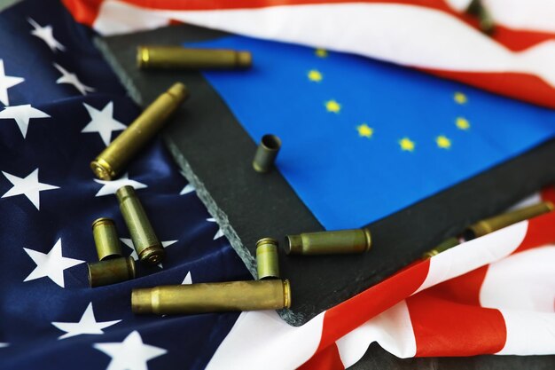 American flag on a gray background Military background with bullets USA and EU collective west