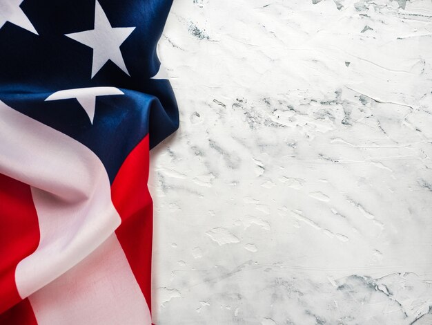 American Flag lying on an empty table. Place for your inscription.