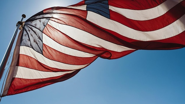 Photo american flag waving in the wind on a background of blue sky