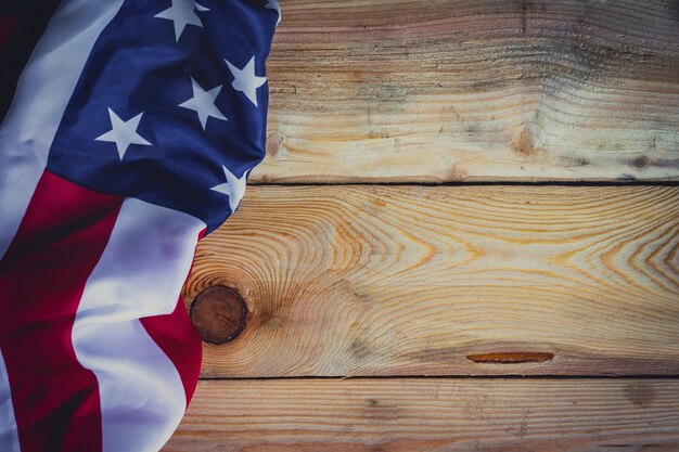 American flag on wooden background with copy space