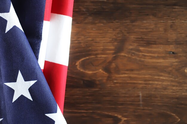 Photo american flag on a wooden texture table and space for text