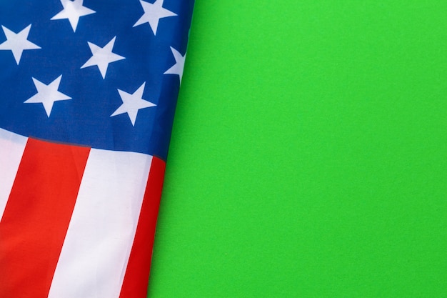 american flags against a green background