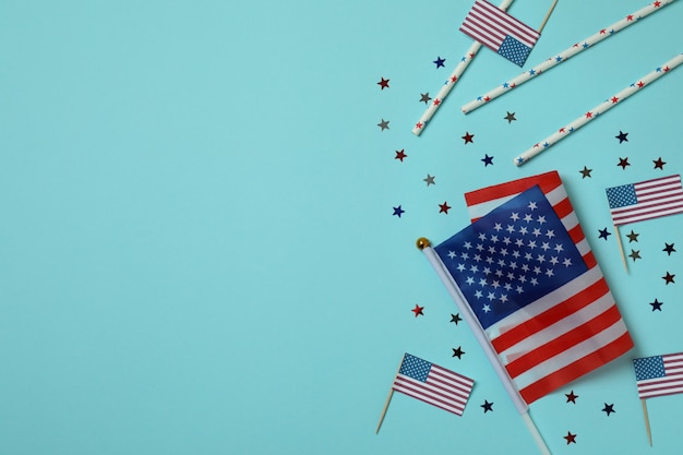 American flags, glitter and straws on blue