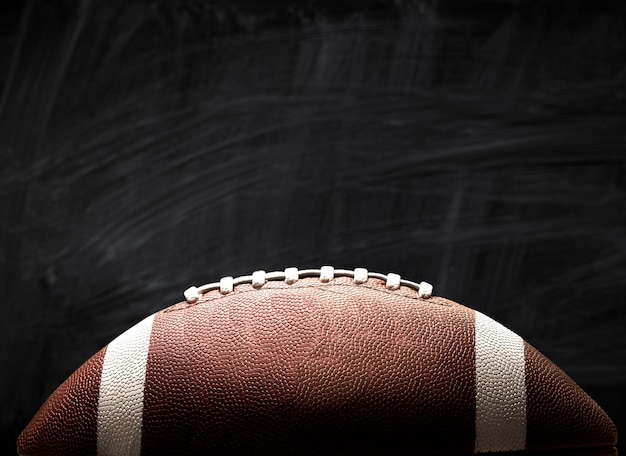 American football ball on background