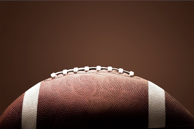 American football ball on background