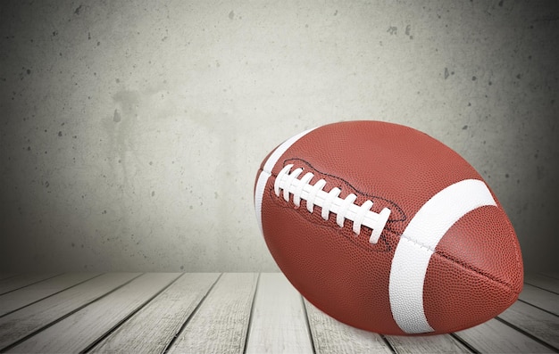 American football ball on dark background