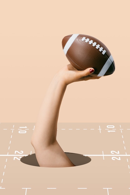 Photo american football ball hold by a woman's hand on the brown background. sport and competition.3d illustration