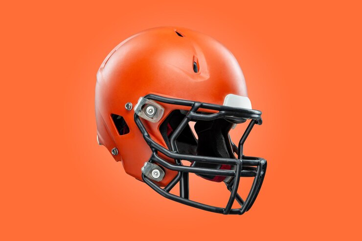 Photo american football helmet on orange background
