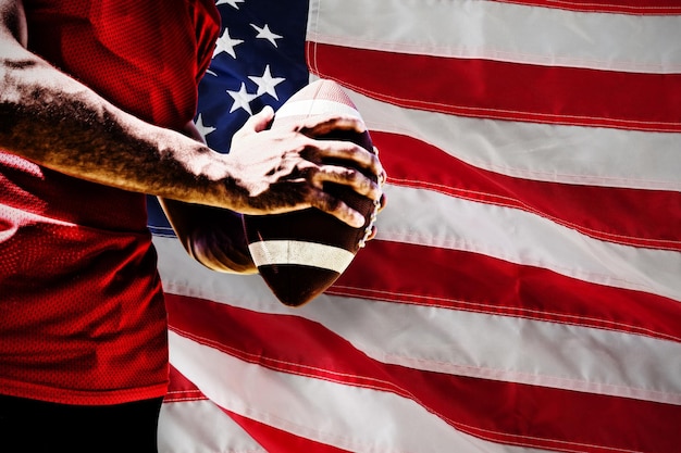 American Football Player against close-up of an american flag