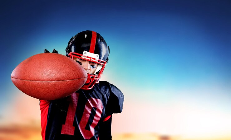 Photo american football player against pitch background