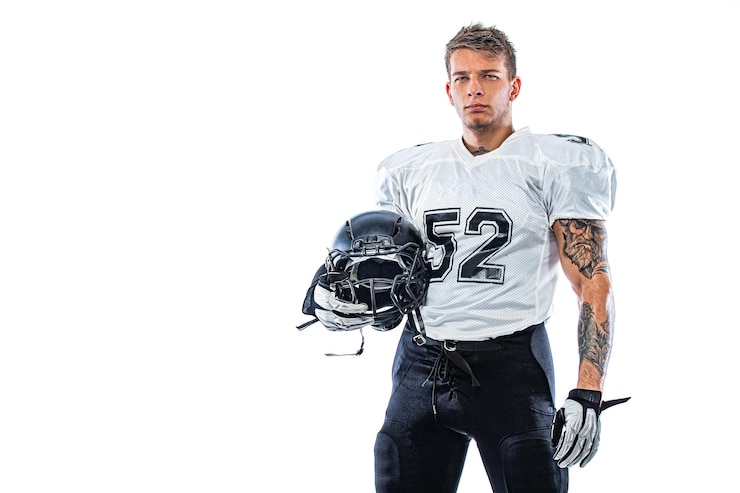 Photo american football player in helmet isolated on white background sport wallpaper