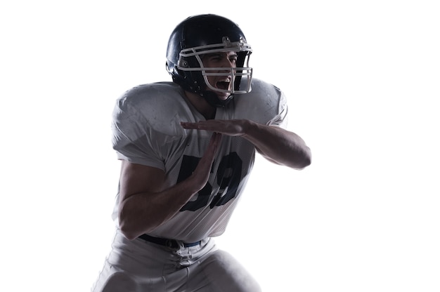 American football player holding ball