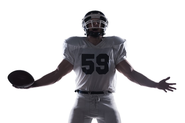 American football player holding ball