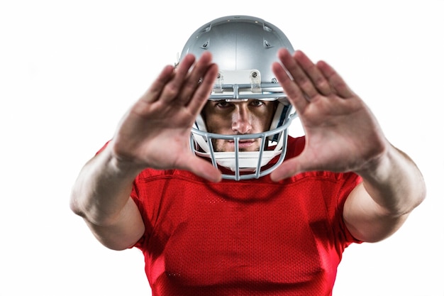 Photo american football player in red jersey defending