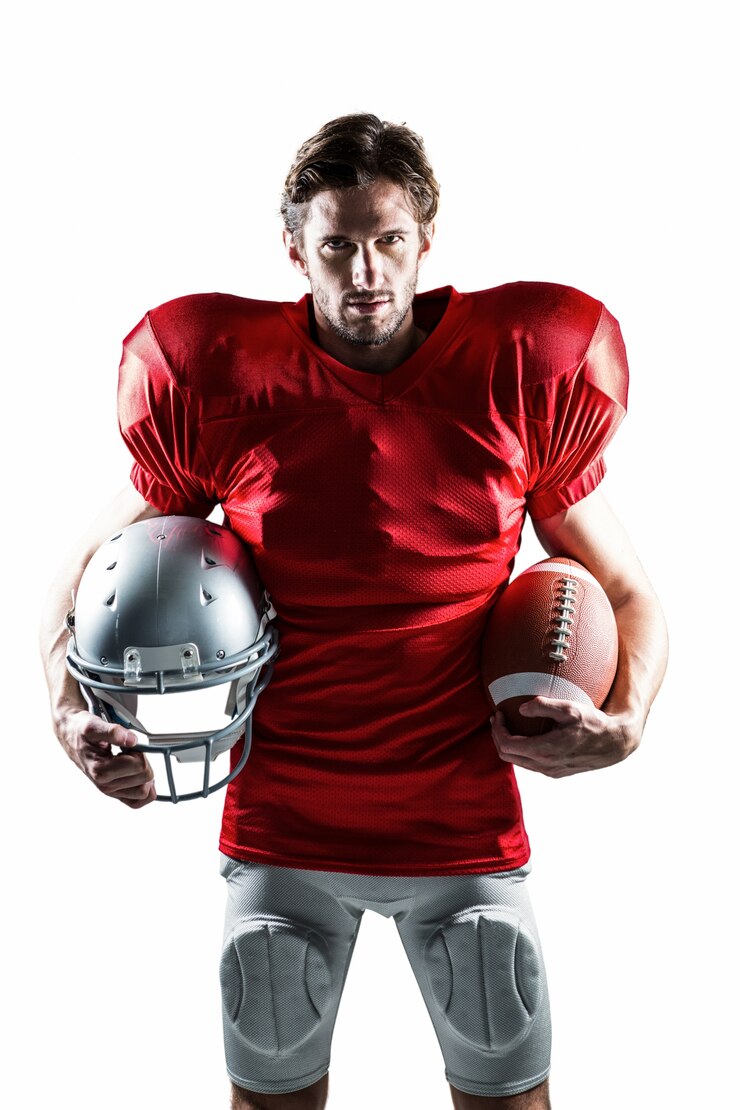 Photo american football player in red jersey holding helmet and ball
