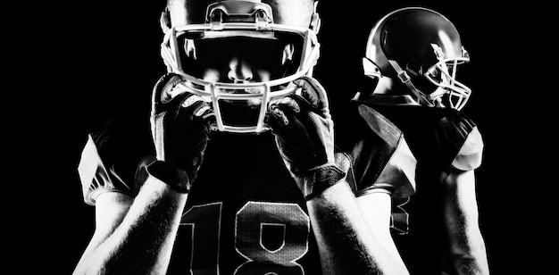 Photo american football player standing in rugby helmet