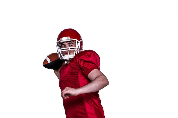 American football player throwing a ball