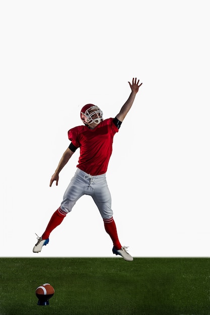 American football player trying to catch football