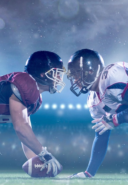 Photo american football players are ready to start a match on modern field at night