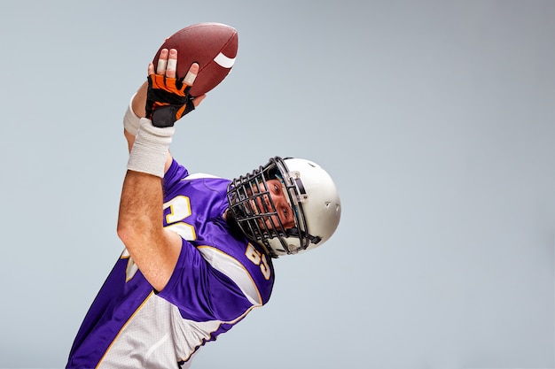 American football sportsman player on black background