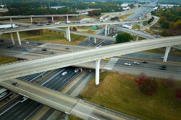 American freeway intersection with fast driving cars and trucks View from above of USA transportation infrastructure