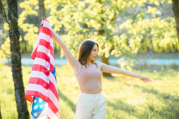 American girl Happy young woman with USA flag