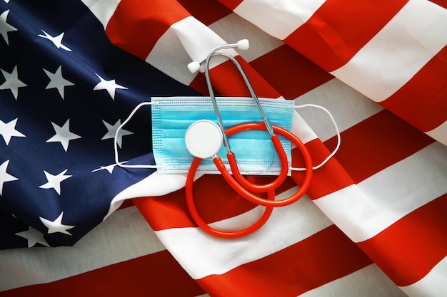 Photo american health care system usa flag background medical mask and restrictions