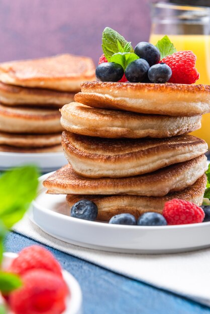 American Pancakes Served with Fresh Berry Fruits and Honey Shrove Tuesday