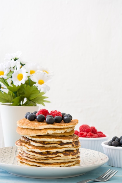 American pancakes with raspberries and blueberries