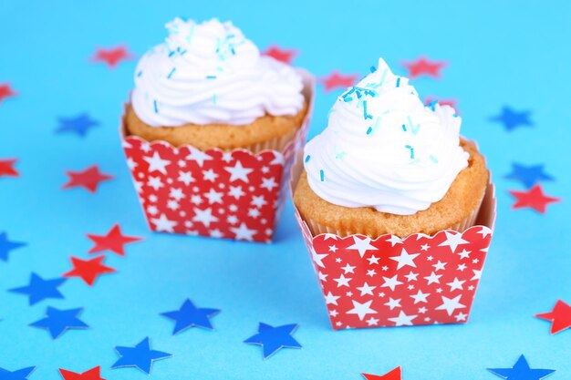 American patriotic holiday cupcakes on blue background