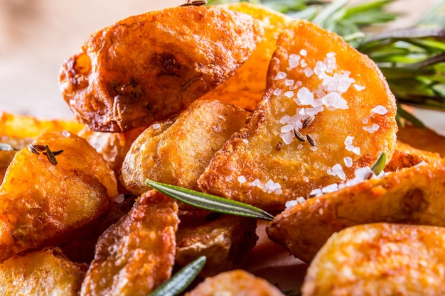 American potatoes with salt rosemary and cumin Roasted potato wedges delicious crispy