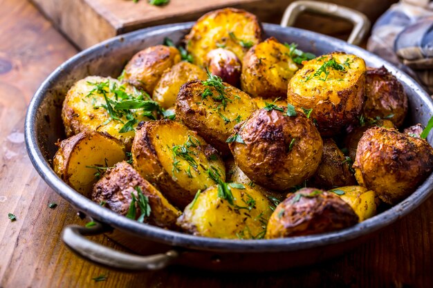 american roasted potatoes with smoked bacon garlic salt pepper cumin dill parsley  herb decoration