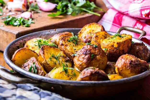 american roasted potatoes with smoked bacon garlic salt pepper cumin dill parsley  herb decoration