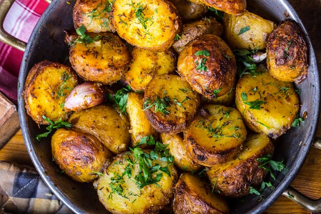 American roasted potatoes with smoked bacon garlic salt pepper cumin dill parsley  herb decoration